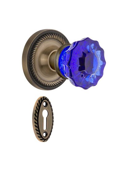 Rope Rosette Mortise Lock Set with Colored Fluted Crystal Glass Knobs Cobalt Blue in Antique Brass.